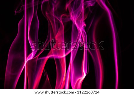 Abstract colored background. Pink smoke, ink in water, the patterns of the universe. Abstract movement, frozen multicolor flow of paint. 
