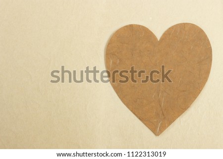 Heart shape 
 in paper craft natural background
