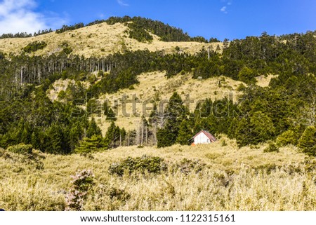 Xinda Hut/Campground And The Holy Ridge Under Blue Sky At Wuling Quadruple Mountains Trail, Shei-Pa National Park, Taiwan Royalty-Free Stock Photo #1122315161