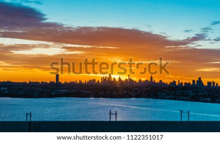 A scenic sunrise view of Manhattan as seen from Jersey City.