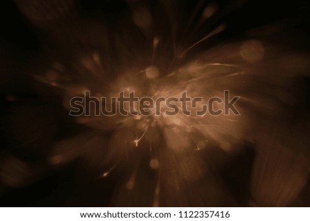  sparks from  hot-red metal, flashes in the dark, bokeh warm tones. 