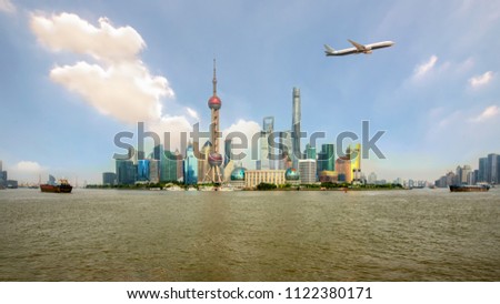 Shanghai's skyscrapers and airplanes on sky