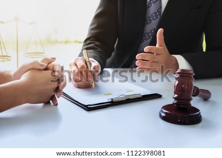 Business law concept, Lawyer business lawyers are consulting lawyers for women entrepreneurs to file a copyright lawsuit. Royalty-Free Stock Photo #1122398081