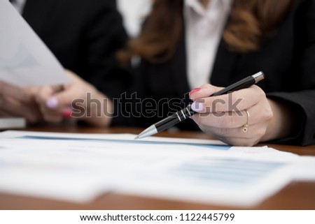 young business people having a meeting. businessman & businesswoman working with financial chart report. startup man & freelance woman discussing market plan at workplace. discussion, teamwork, 
