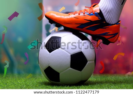 Close up legs and feet of soccer player or football player walk on green grass ready to play match on national Mexico flag background.