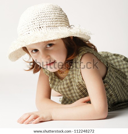 little summer girl with straw hat