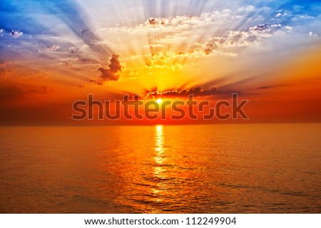 sunrise in the sea Royalty-Free Stock Photo #112249904