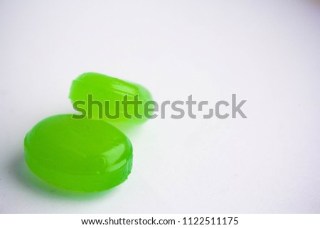 Two candies on a white background