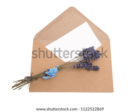 craft paper envelope with a blank  for mail post and lavender isolated on the white