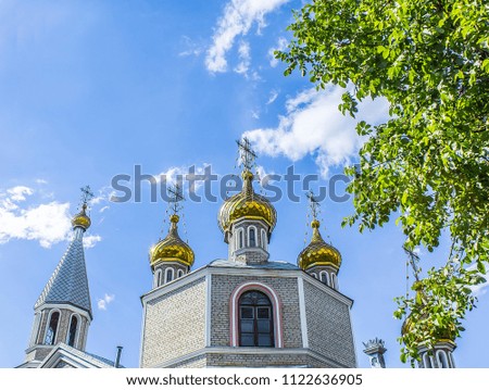 Domes of the church against the sky with clouds