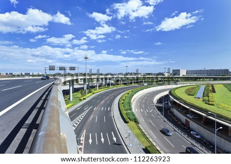 Road network around Beijing Capital Airport Terminal 3, the second largest airport terminal in the world. Royalty-Free Stock Photo #112263923