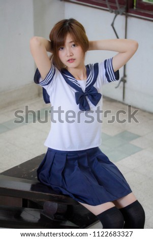 Portrait of thai teen beautiful girl in japanese student uniform happy and relax