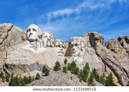 Presidential sculpture at Mount Rushmore national memorial, USA. Sunny day, blue sky. Royalty-Free Stock Photo #1122688556