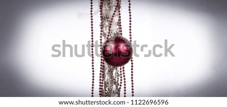 red Christmas ball and Golden garland on white background