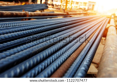 steel rebar for reinforcement concrete at construction site with house under construction background Royalty-Free Stock Photo #1122707477