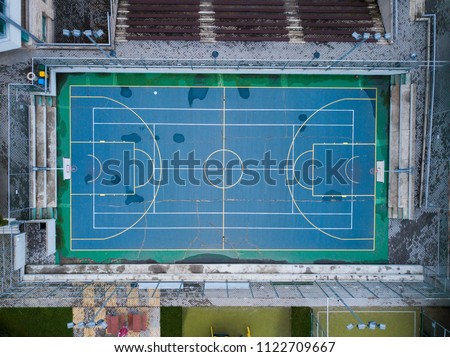 Aerial view of basketball and tennis court in one