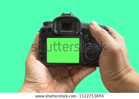 Camera in hands on isolated green screen, path included