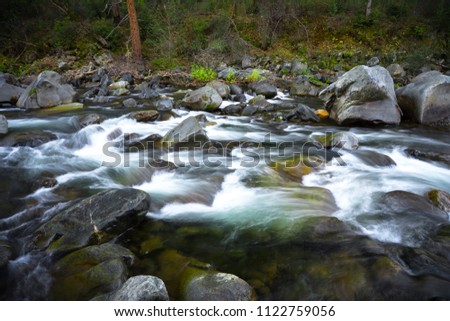 Whitewater rapids with smooth long exposure - Tuolomne River in Groveland, California.