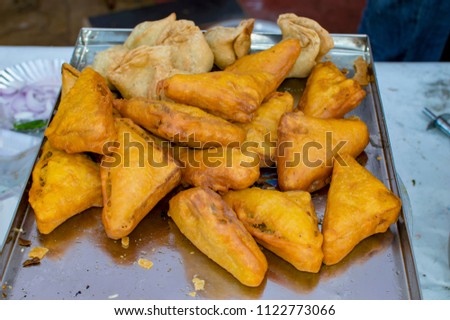 Indian food samose and bread pakode on sale for serving Royalty-Free Stock Photo #1122773066
