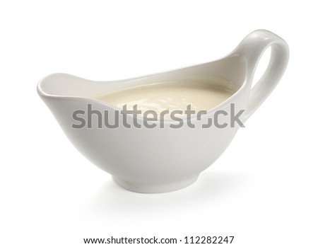 Cream cheese sauce in the white sauceboat Royalty-Free Stock Photo #112282247