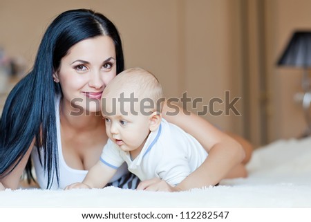 mother playing with baby