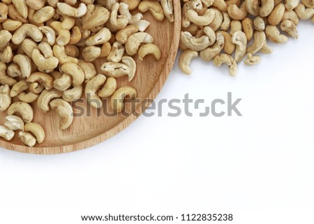 Closeup top view of cashew nuts on  white background