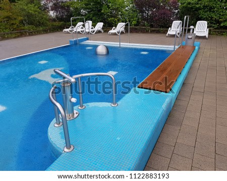Swimming pool | Blue spa swimming pool with clean water Royalty-Free Stock Photo #1122883193
