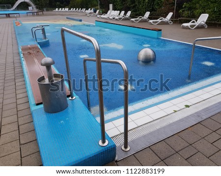 Swimming pool | Blue spa swimming pool with clean water Royalty-Free Stock Photo #1122883199