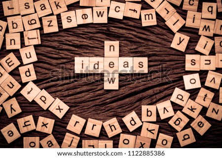 New ideas word written cube on wooden background. Vintage concept.