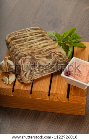 Home-made meat loaf on a wooden surface.