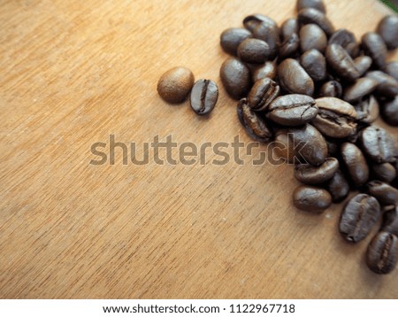 Top view Coffee beans on wooden table background.