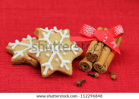 Christmas biscuits. Festive cookies decorated with royal frosting and cinnamon stick and cloves