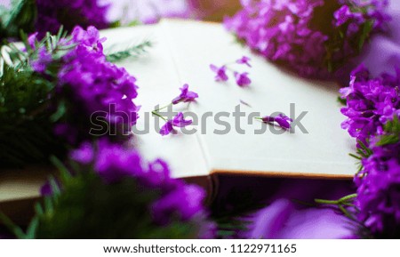 Vintage novel books with bouquet of flowers