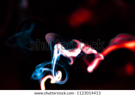 Abstract colorful smoke like colorful gradient background with flash light flare

