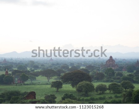 view from shwesandow pagoda a lot of old temples in the field of tree with the mist bagan myanmar Royalty-Free Stock Photo #1123015268