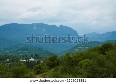 Mountain forest landscape covered by green pine under morning sky with clouds, Country Side