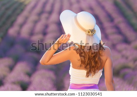 Young woman a white dress in lavender field