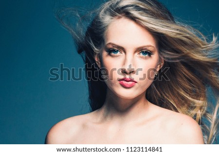 Blonde female with beautiful long curly  blond haierstyle