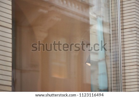 Empty boutique window from outside for logo or work time design promotion.
