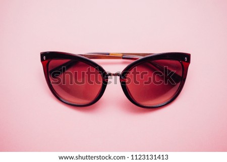 sunglasses on pink background
