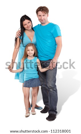 Mother, father and little daughter stand embraced and holding hands