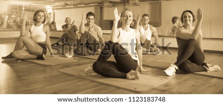 many  positive people exercising in dance hall