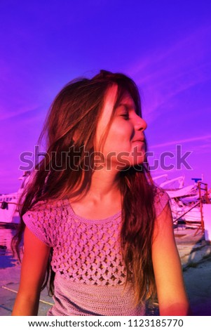 a girl near the yachts
