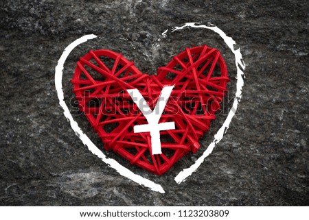 Love of money. China Yuan symbol on a red heart. Love theme