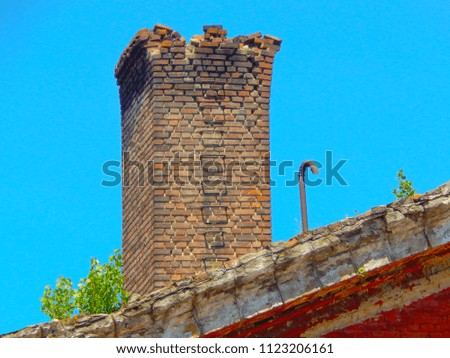 Ancient smoke from the red brick wall with a staircase.