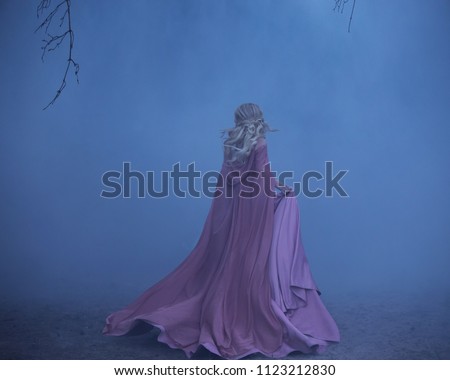 A frightened girl blonde runs in a thick fog. On the elf, a luxurious pink dress with a long train and a raincoat. The photo from the back without a face. Artistic retouching.