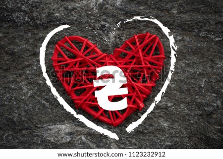 Love of money. Ukraine Hryvna symbol on a red heart. Love theme