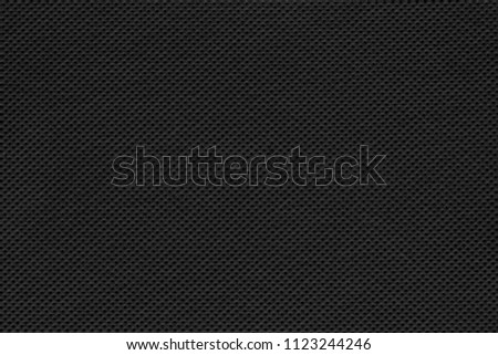 Carbon fiber texture. Black raw material background.