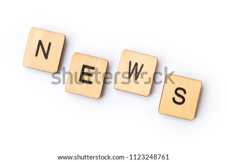 The word NEWS spelt out with wooden lettered tiles.