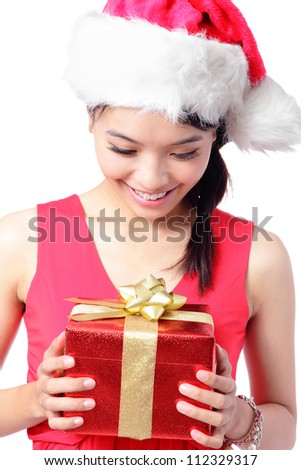 close up of young santa girl smile and happy look Christmas gift isolated on white background, model is a asian woman